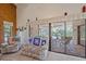 Relaxing living room with view of screened pool area at 4674 Hidden River Rd, Sarasota, FL 34240