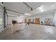 Spacious garage, perfect for workshop, with a motorcycle and various tools at 4674 Hidden River Rd, Sarasota, FL 34240