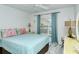 Guest bedroom with full-size bed and window at 4640 Tower Hill Ln # 2322, Sarasota, FL 34238