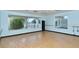 Bright exercise room with wood floors and natural light at 4640 Tower Hill Ln # 2322, Sarasota, FL 34238