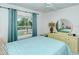 Bedroom with full-size bed and large mirror at 4640 Tower Hill Ln # 2322, Sarasota, FL 34238