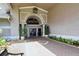 Stoneybrook clubhouse entrance with inviting walkway at 4640 Tower Hill Ln # 2322, Sarasota, FL 34238