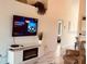 Bright living room features a fireplace and large TV at 4640 Tower Hill Ln # 2322, Sarasota, FL 34238