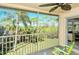 Relaxing screened balcony overlooking lush landscaping at 4640 Tower Hill Ln # 2322, Sarasota, FL 34238