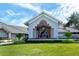 Elegant clubhouse exterior with manicured landscaping at 4640 Tower Hill Ln # 2322, Sarasota, FL 34238