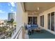 Wide balcony with furniture and views of the water and city skyline at 35 Watergate Dr # 503, Sarasota, FL 34236