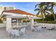 A poolside bar and lounge with TVs, seating, and umbrellas offers a relaxing entertainment area at 35 Watergate Dr # 503, Sarasota, FL 34236