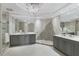 Elegant bathroom featuring dual vanities, a walk-in shower, and modern lighting fixtures at 35 Watergate Dr # 503, Sarasota, FL 34236