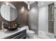 Modern half bathroom with a vessel sink, decorative faucet, and stand up shower with accent tiles at 35 Watergate Dr # 503, Sarasota, FL 34236