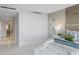 Bright and spacious bedroom with a king bed, accent wall, and neutral decor at 35 Watergate Dr # 503, Sarasota, FL 34236
