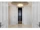 Elegant elevator lobby with marble floors, decorative wallpaper, and a view of the elevator at 35 Watergate Dr # 503, Sarasota, FL 34236