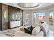 Living room with a unique accent wall, large windows, neutral furniture, and a modern design at 35 Watergate Dr # 503, Sarasota, FL 34236