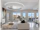 Bright and airy living room with large windows, custom ceiling, and stylish furniture at 35 Watergate Dr # 503, Sarasota, FL 34236