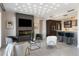 Living room with modern fireplace, wet bar, luxury floors, and recessed lighting at 35 Watergate Dr # 503, Sarasota, FL 34236