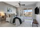 Beautiful main bedroom features a ceiling fan and a sliding glass door with a view to the outside at 35 Watergate Dr # 503, Sarasota, FL 34236