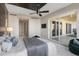 This bedroom features a ceiling fan, television, and sliding glass doors to the outside at 35 Watergate Dr # 503, Sarasota, FL 34236