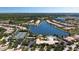 Aerial view of community with lake, tennis courts, and clubhouse at 5814 Benevento Dr, Sarasota, FL 34238