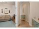 Bright hallway with painted cabinets and coastal decor at 5814 Benevento Dr, Sarasota, FL 34238