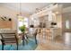 Eat-in kitchen with white cabinets, stainless steel appliances, and a breakfast bar at 5814 Benevento Dr, Sarasota, FL 34238