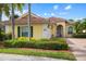 Attractive single-story house with a tile roof and landscaped front yard at 5814 Benevento Dr, Sarasota, FL 34238