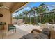 Relaxing screened patio with wicker furniture at 5814 Benevento Dr, Sarasota, FL 34238