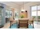 Casual breakfast nook with a round glass table and comfortable seating at 5814 Benevento Dr, Sarasota, FL 34238
