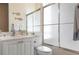 Clean bathroom, featuring a shower and white vanity at 5814 Benevento Dr, Sarasota, FL 34238