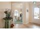 View from entryway into dining room and outside at 5814 Benevento Dr, Sarasota, FL 34238