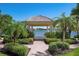 Gazebo with lake view, surrounded by lush landscaping at 5814 Benevento Dr, Sarasota, FL 34238