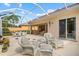Large screened patio, offering both seating and dining at 5814 Benevento Dr, Sarasota, FL 34238