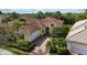 An aerial view showcasing a house and its surrounding neighborhood at 5814 Benevento Dr, Sarasota, FL 34238