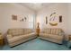 Relaxing sitting room with two sofas and decorative wall art at 5814 Benevento Dr, Sarasota, FL 34238