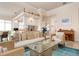 Open living space with a comfortable sofa, adjacent to the kitchen and dining area at 5814 Benevento Dr, Sarasota, FL 34238