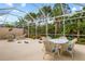 Enjoy this large screened patio with dining area at 5814 Benevento Dr, Sarasota, FL 34238