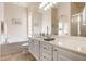 Bathroom features a double vanity, soaking tub and shower at 5814 Benevento Dr, Sarasota, FL 34238