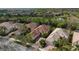 Aerial view of a house nestled in a community of similar homes at 5814 Benevento Dr, Sarasota, FL 34238