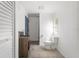Simple bathroom with toilet and a small sink at 2345 Floyd St, Sarasota, FL 34239