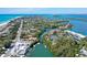 Aerial view of waterfront property near marina and beach at 600 Dream Island Rd, Longboat Key, FL 34228