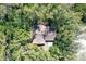 House nestled in lush greenery, seen from above at 600 Dream Island Rd, Longboat Key, FL 34228