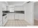 Modern kitchen with white cabinets and new appliances at 3915 Schwalbe Dr # 128, Sarasota, FL 34235
