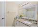 Bright bathroom with granite countertop, white cabinets, and a shower/tub combo at 4166 Central Sarasota Pkwy # 533, Sarasota, FL 34238