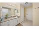 Bathroom with granite countertop, white cabinets, and a shower/tub combo at 4166 Central Sarasota Pkwy # 533, Sarasota, FL 34238