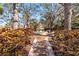 Brick pathway leads to a beautiful tiered fountain in a lush garden at 4166 Central Sarasota Pkwy # 533, Sarasota, FL 34238