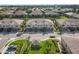 Aerial view of townhouses with a community space and landscaping at 4174 Overture Cir # 519, Bradenton, FL 34209