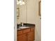 Small half bathroom with dark vanity and granite top at 4174 Overture Cir # 519, Bradenton, FL 34209