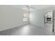 Bright bedroom with ceiling fan and vinyl plank flooring at 4576 Ringwood Mdw # 5, Sarasota, FL 34235