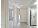 Clean entryway with wood-look floors, a white door, and built-in shelving at 4576 Ringwood Mdw # 5, Sarasota, FL 34235