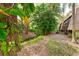 Lush landscaping with mature trees and a tranquil creek at 4576 Ringwood Mdw # 5, Sarasota, FL 34235