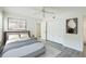 Bedroom with plush bed, large closet and ceiling fan at 4576 Ringwood Mdw # 5, Sarasota, FL 34235