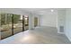Living area with sliding doors leading to a patio at 4576 Ringwood Mdw # 5, Sarasota, FL 34235